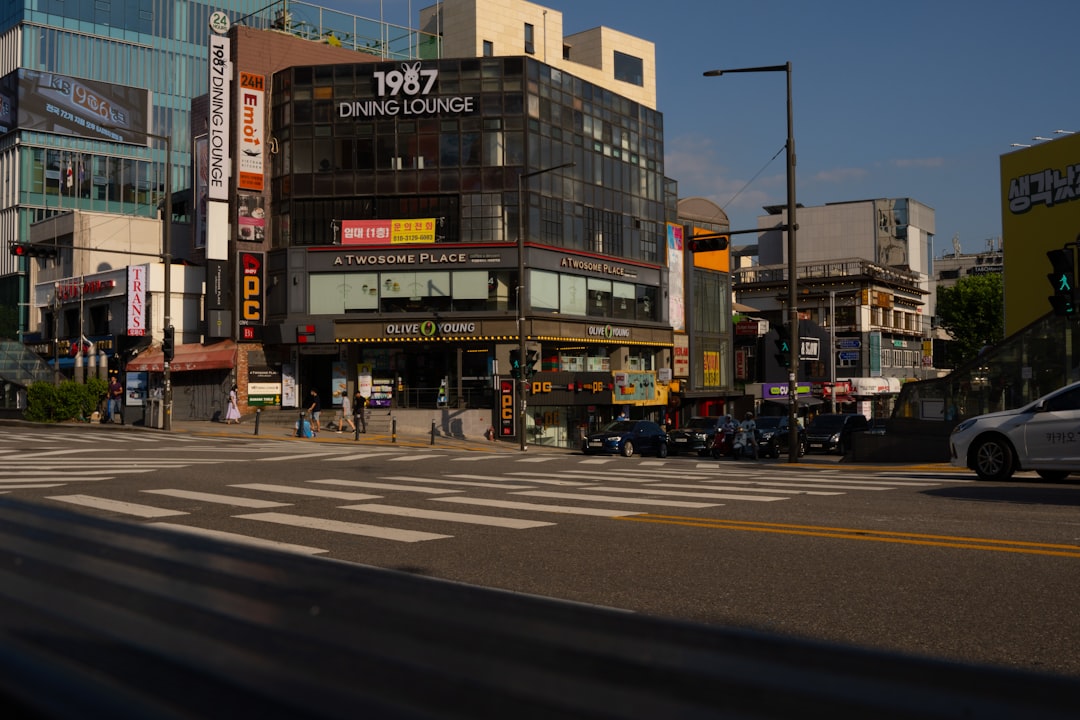 a street with cars and buildings on the side