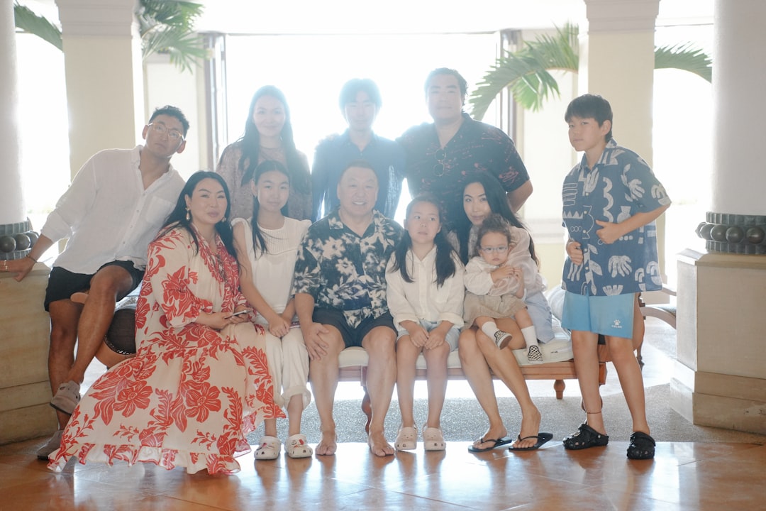 A large family poses for a group portrait indoors.