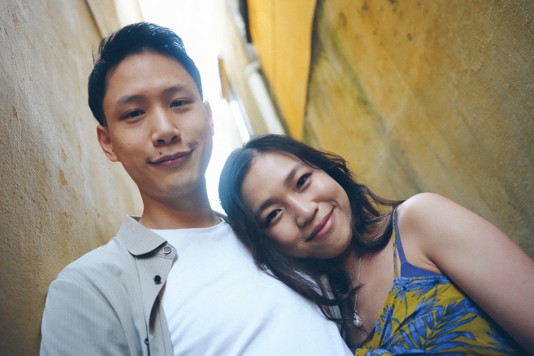 Young couple leaning together in an alleyway